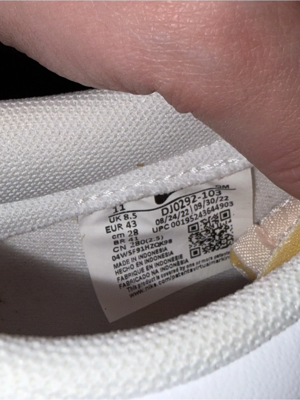 Nike Women's White Sneaker with Pink Swoosh